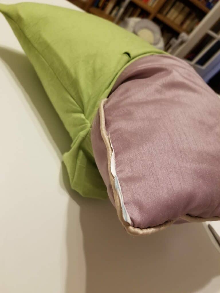 Stuffing the pillow form into the upcycled shirt