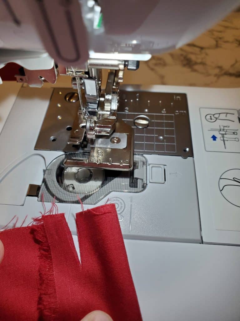 cutting a piece in the fabric