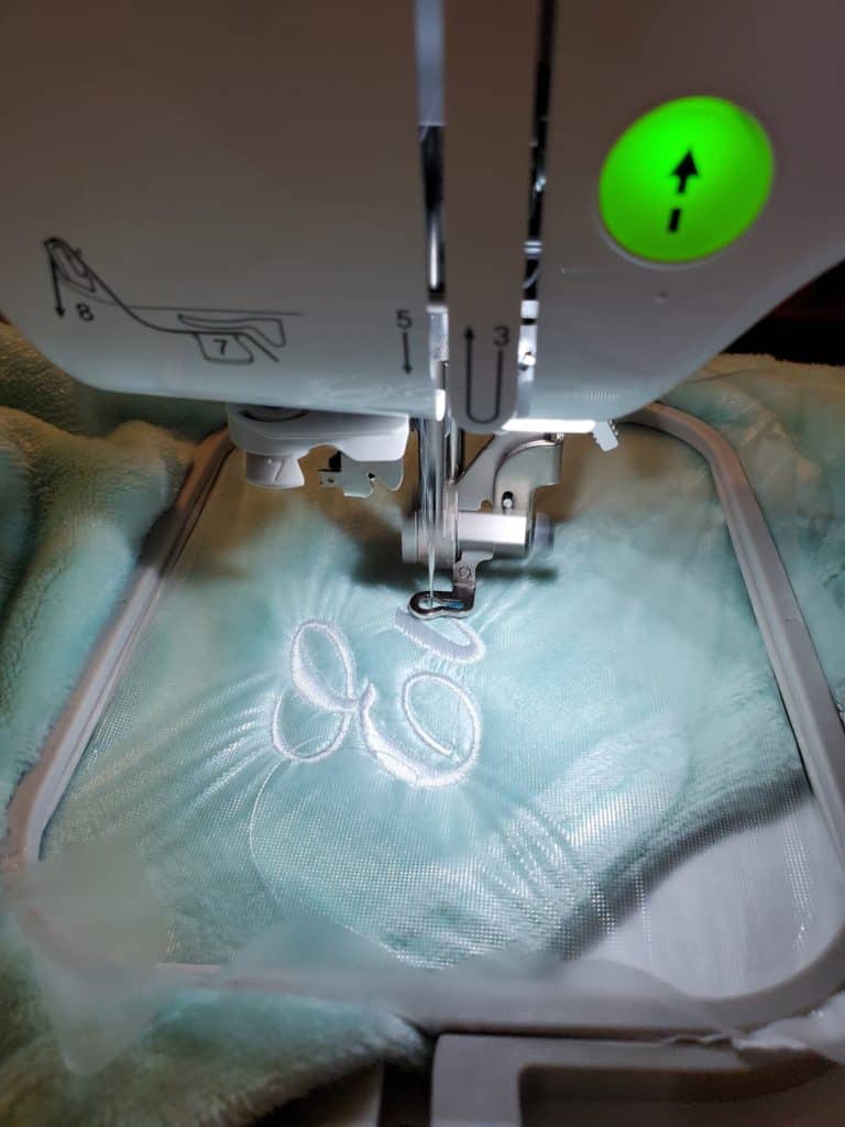 embroidering a baby blanket