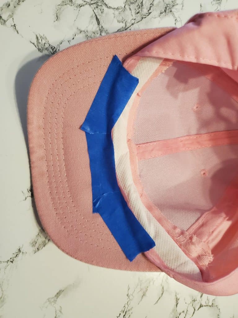 pull the flap out of the way and tape on the cap