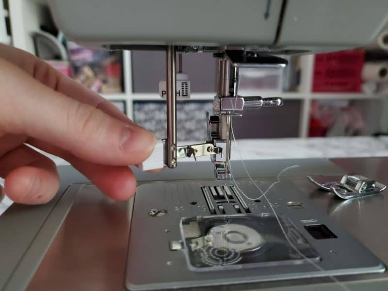 rethread the needle using your fingers or the needle threader