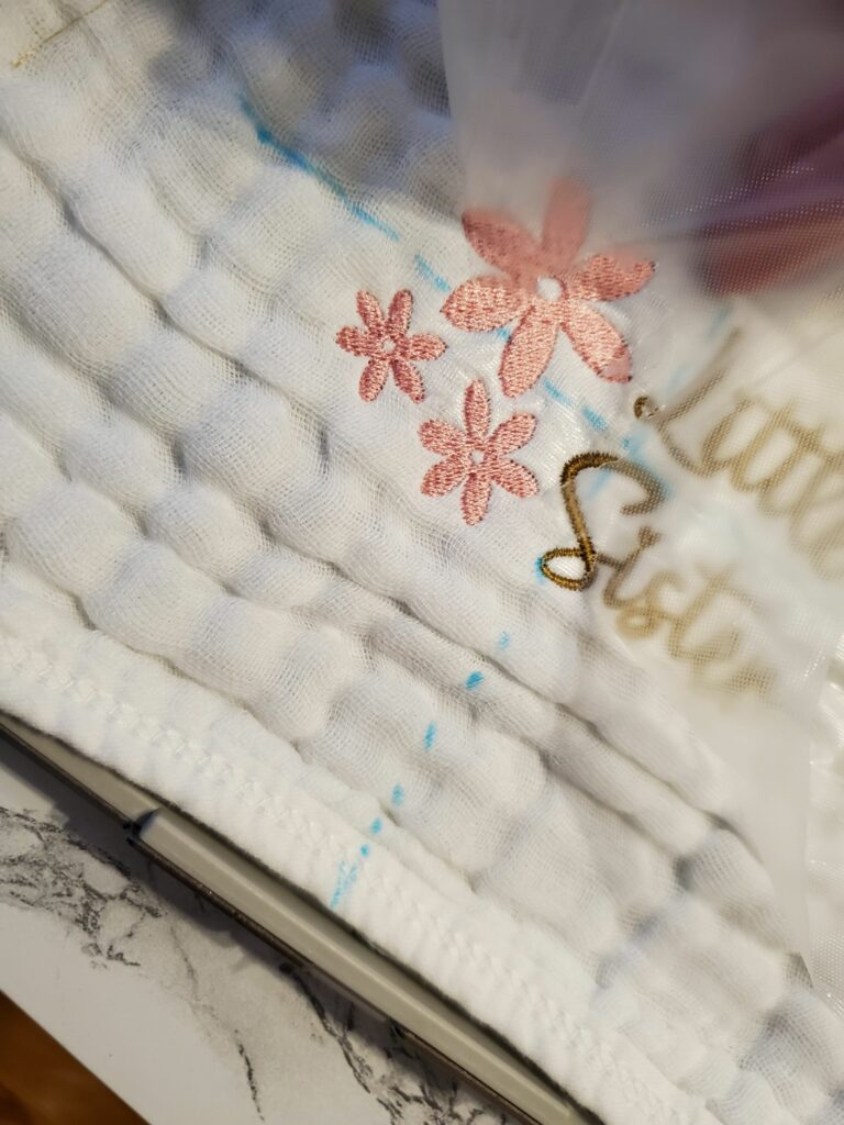 remove water soluble topping from embroidered burp cloth