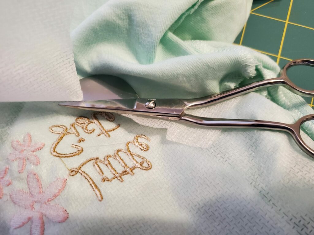 trim stabilizer on back of onesie