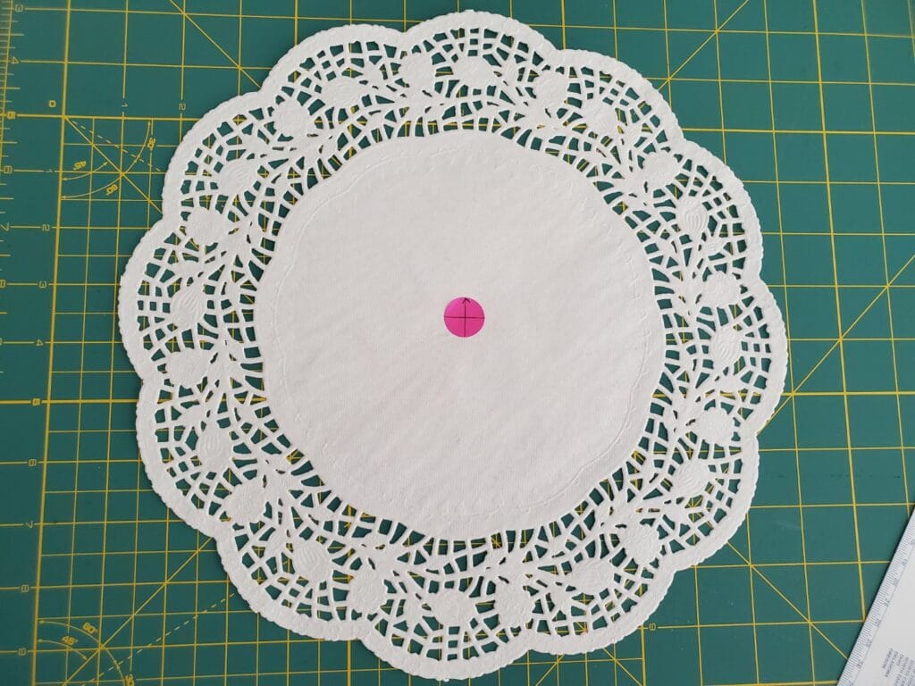 use a placement sticker to mark the doily