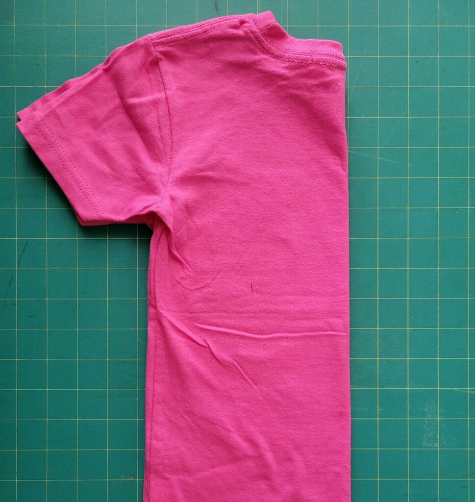 fold a shirt in half to find the exact center