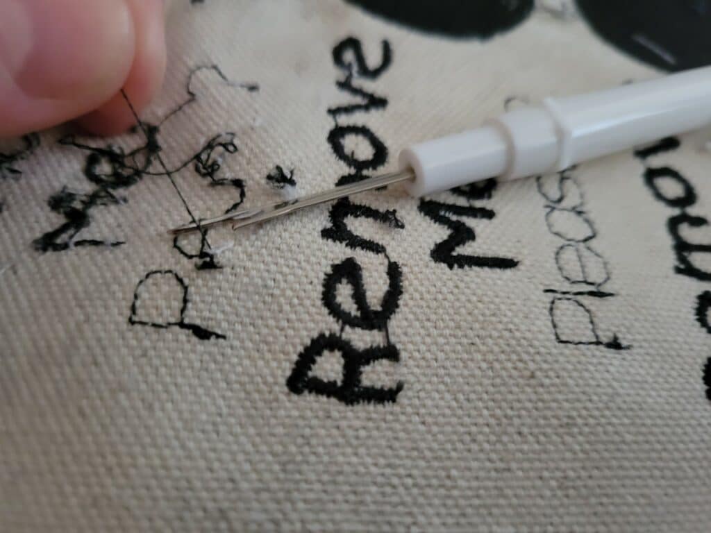 how to remove embroidery with a seam ripper