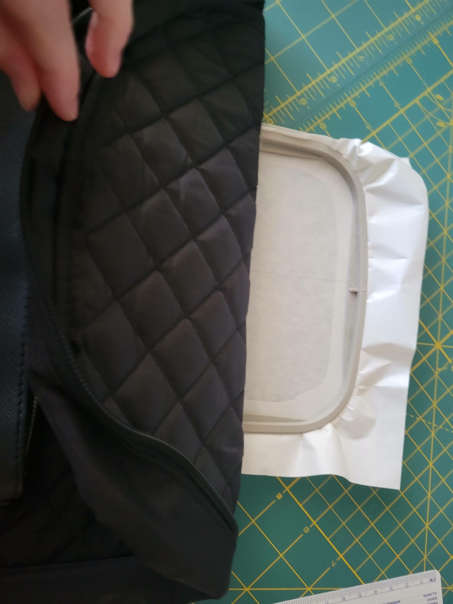 fold the backpack and press down on the stabilizer