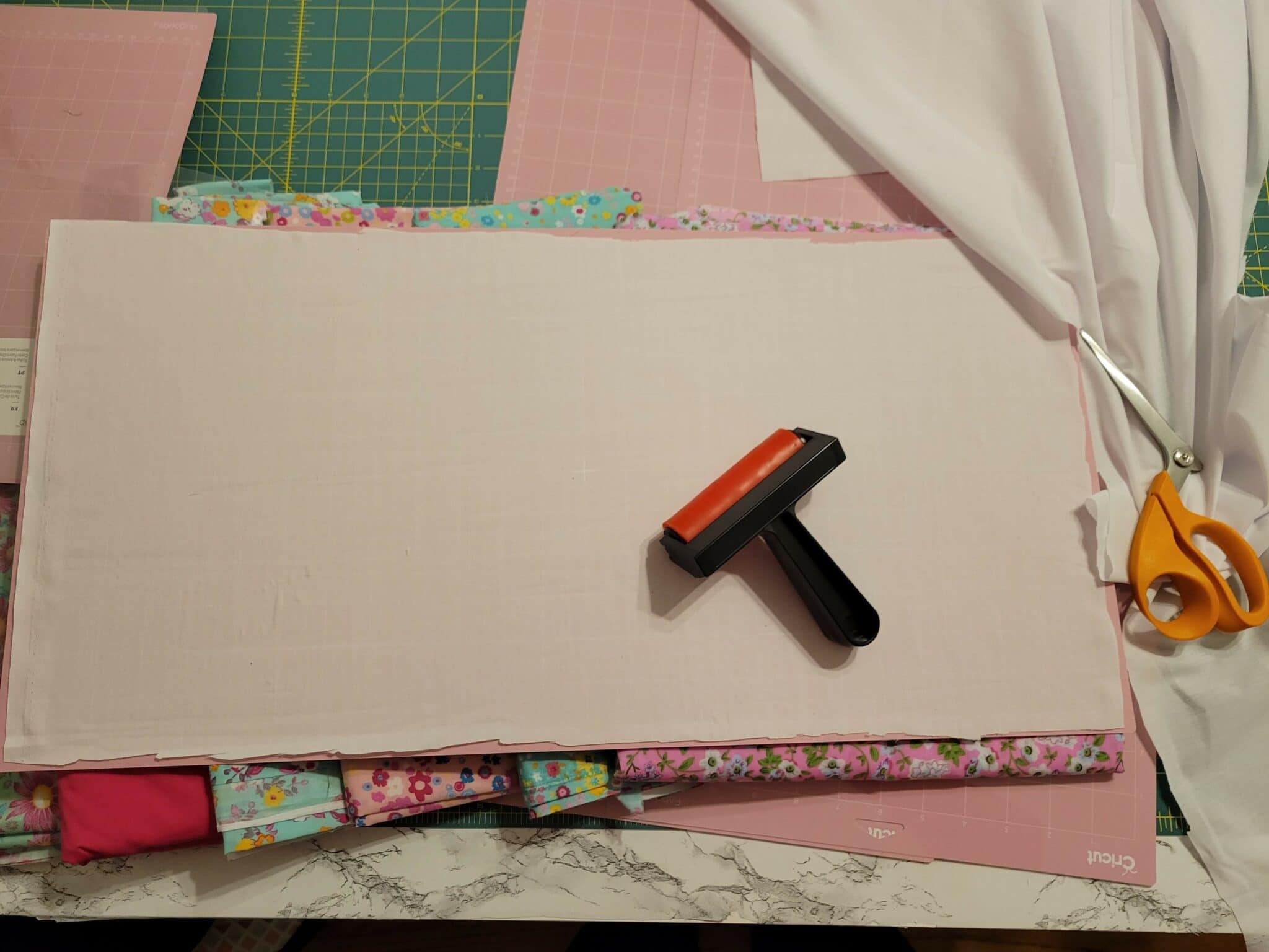 use a brayer to smooth out fabric