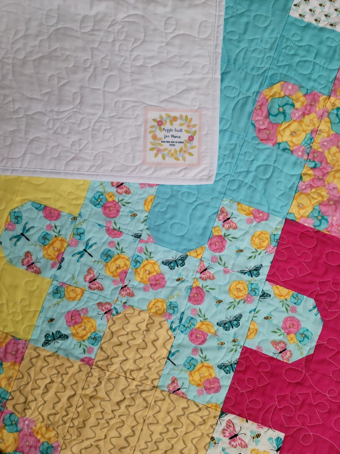 puzzle quilt with label made by cricut