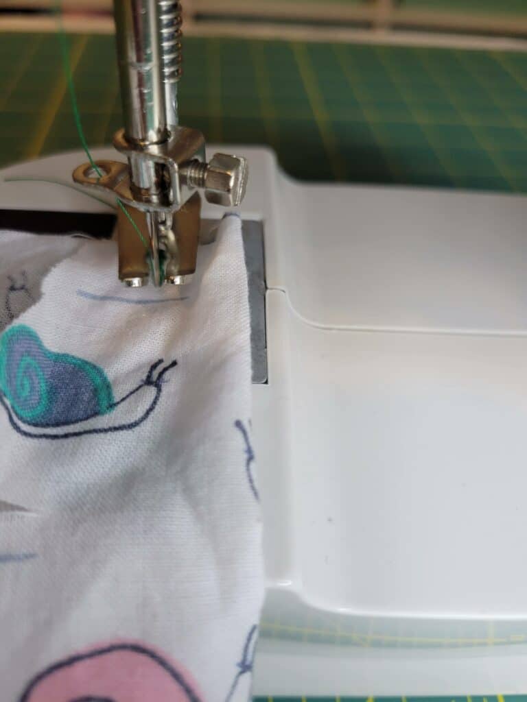 operating a mini sewing machine