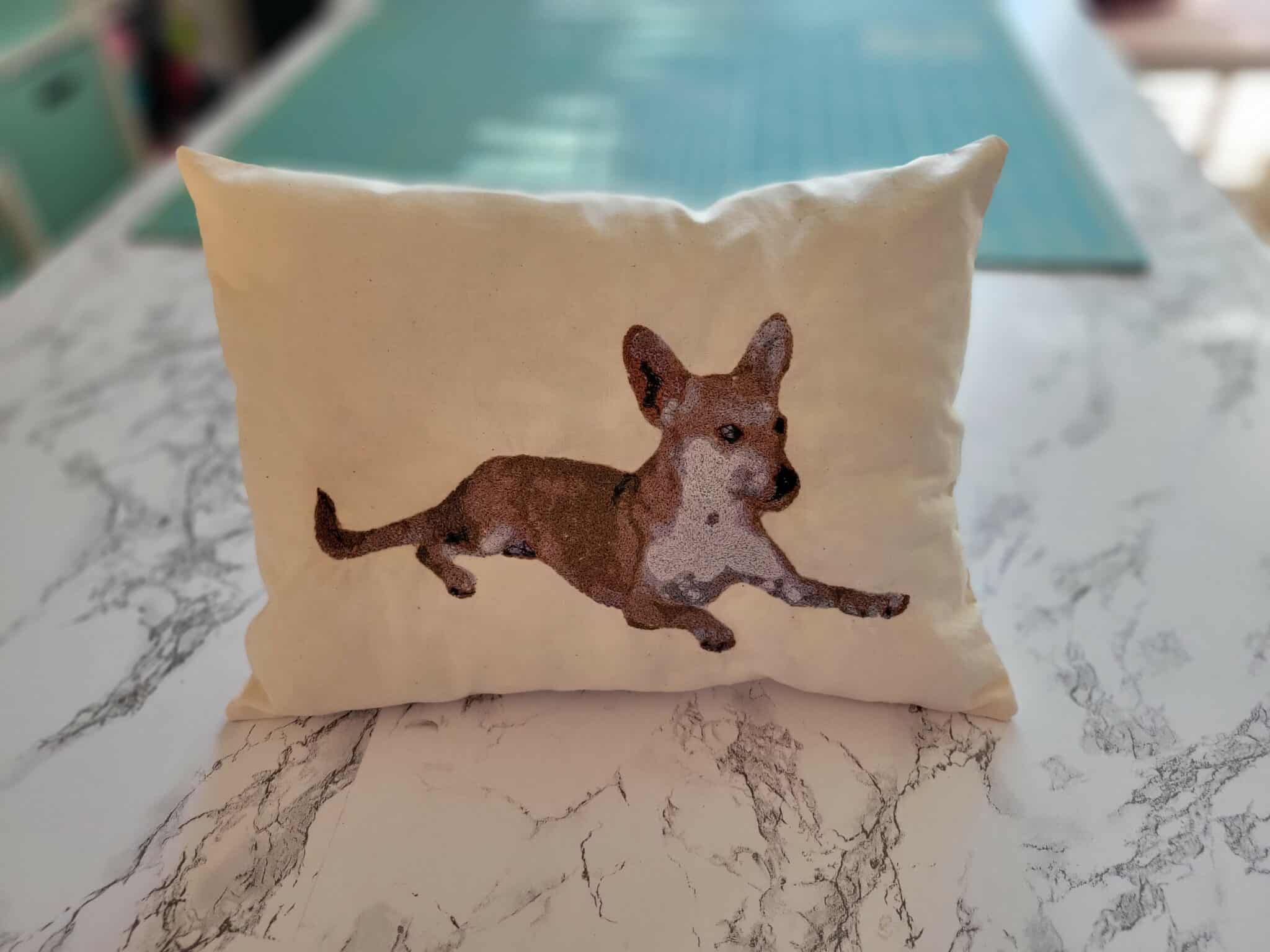 a pillow with embroidered dog photo on it!