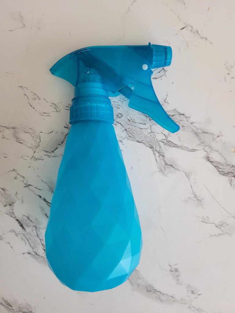 spray bottle with water-soluble stabilizer in it