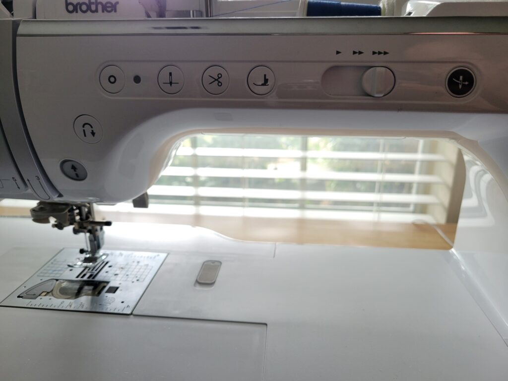 fully computerized sewing machine with buttons